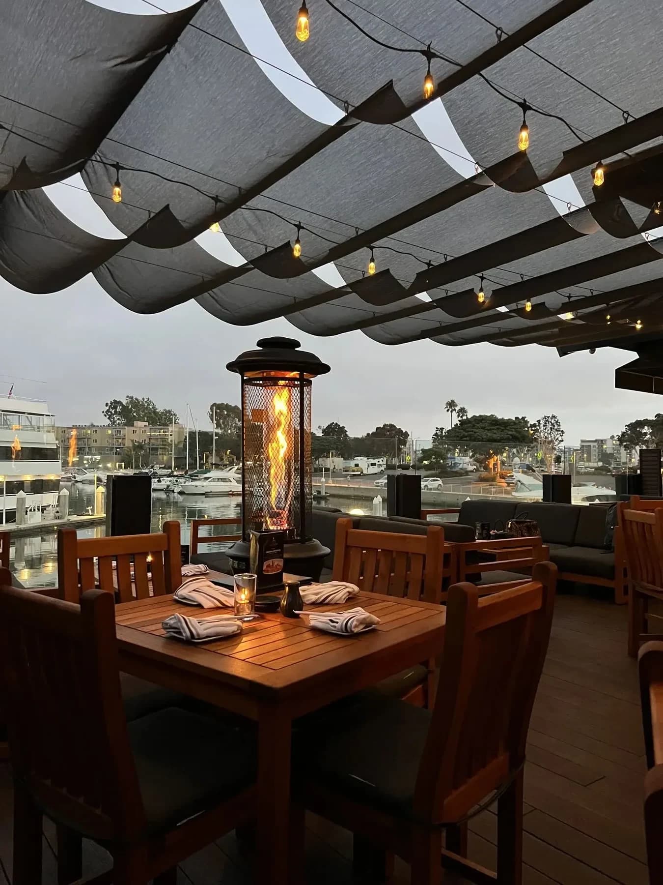 Happy hour evening patio fire heater at Killer Shrimp Marina del Rey