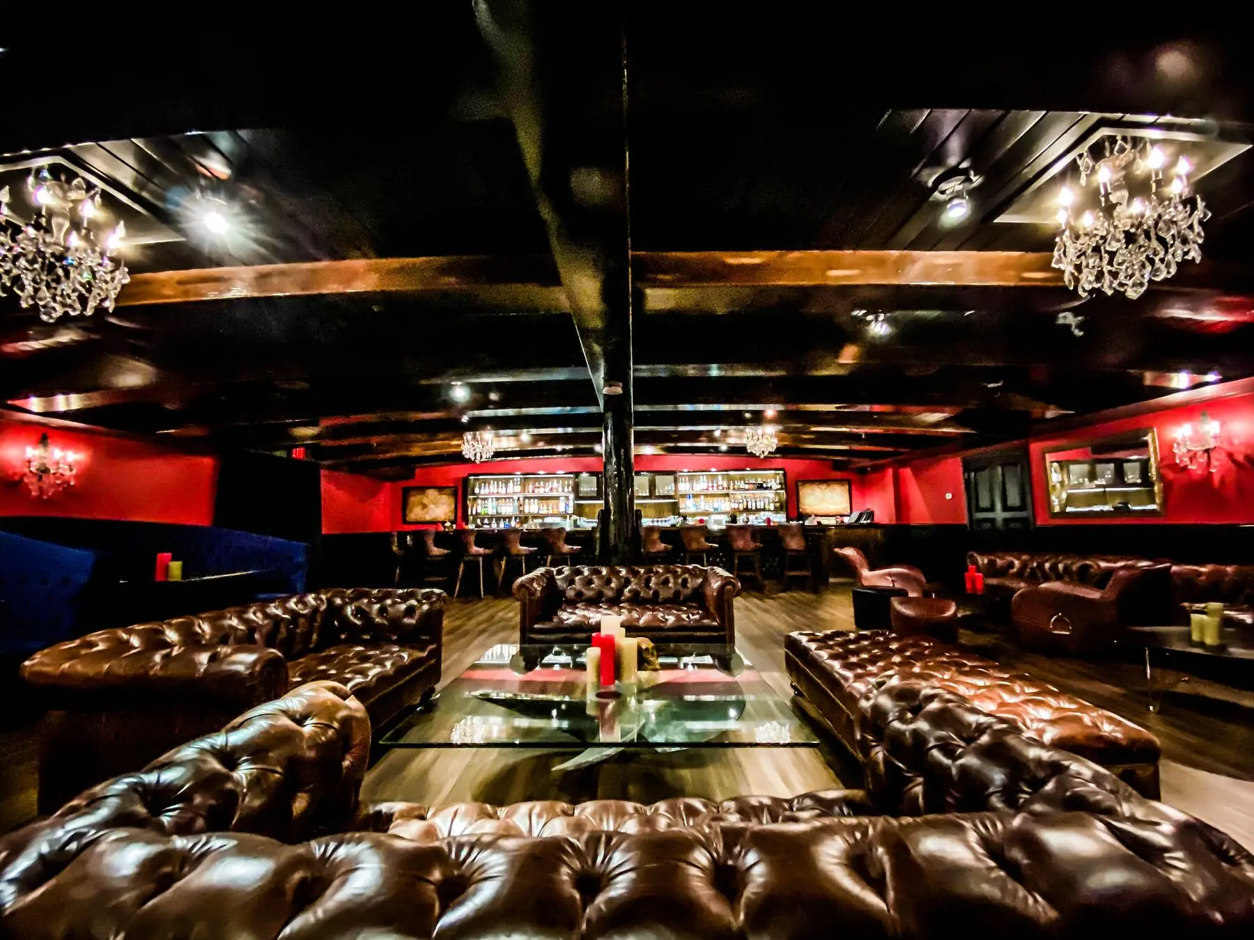 Killer Yacht Club lounge with leather sofas and full bar